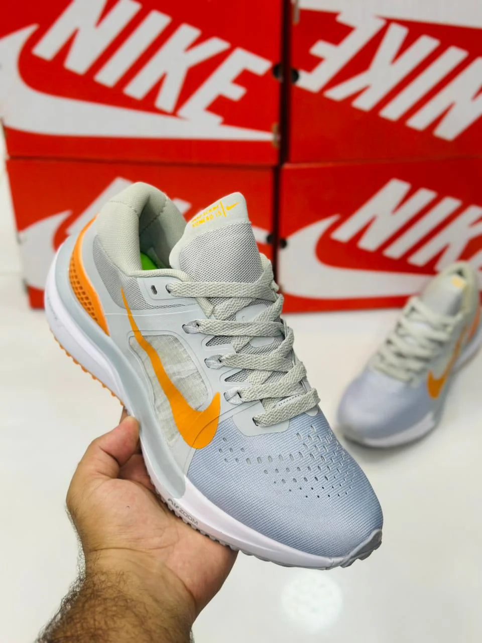NIKE AIR ZOOM VOMERO 15 MULTI GREY AND ORANGE